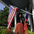 Joe Guinn hangs a Union flag outside of Headquarters House Friday Aug. 13, 2010.