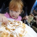 LET THEM EAT CAKE | Olivia Monahan, 2, of Rogers enjoys her first funnel cake Friday while visiting ...
