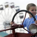 Miller Bohannon, 3, of Rogers scans his surroundings Friday from the driver’s seat of a 1953 Interna...