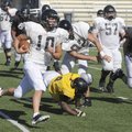  Bentonville quarterback Pearson Gean runs to the edge Monday during practice in Tiger Stadium in Be...