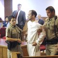 Zachariah Marcyniuk, center, is removed from the courtroom Friday by Washington County Sheriff’s Off...