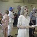 VOW RENEWAL - The Rev. Edie Skalitzky, front, officiates a ‘Renewal of Vows’ ceremony at the Unity C...