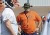  Rogers Heritage coach Perry Escalante looks on Friday during practice in Rogers.
