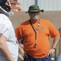  Rogers Heritage coach Perry Escalante looks on Friday during practice in Rogers.
