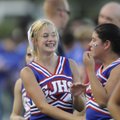 CHEERLEADING CHARM | George Junior High School cheerleader Cassidy Riggins, left, smiles at Jessica ...