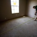 Michael Pennington, owner of Pennington Home Repair and Remodeling, measures the square-footage of a...