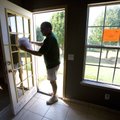 Michael Pennington measures the glass in a patio door Thursday while preparing an estimate for the r...