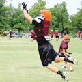 Siloam Springs junior safety Ben Sewell jumps high in the air for an interception during Thursday’s ...