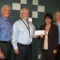 MEALS ON WHEELS GIF- Bill Rogers, executive director of Washington Regional Foundation, and Bill Bra...