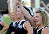 Kayla Cherry, a Bentonville High School senior, cheers Saturday during Tiger Pride night in Bentonville. The Bentonville varsity team gave the fans a sampling of the season with an exhibition at Tiger Stadium.