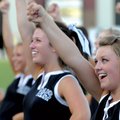 Kayla Cherry, a Bentonville High School senior, cheers Saturday during Tiger Pride night in Bentonvi...