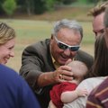 Former Florida State football coach Bobby Bowden greets 4-month-old Charlie Galloway on Sunday outsi...