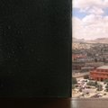 FILE - In this June 30, 2010 file photo, a bullet hole from a gun battle in Juarez is seen on the wa...