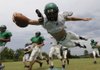Greenland’s Parrish Diaz dives for the end zone during practice.