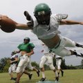 Greenland’s Parrish Diaz dives for the end zone during practice.