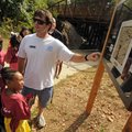 Paul Gehrki, right, youth development coordinator for the Donald W. Reynolds Boys & Girls Club, poin...