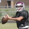 Gentry quarterback Austin Millsap looks for a receiver Wednesday during practice in Gentry.