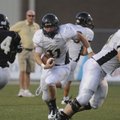 Bentonville’s Garrett Kaufman looks for running room Saturday during Tiger Pride Night in Tiger Stad...