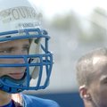 Rogers High’s Mason Young waits to get back into the fray Aug. 19 during practice in Rogers. Young g...