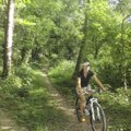 Forest surrounds Janna Perry-Holloway on a stretch of the Slaughter Pen Trail in Bentonville. The tr...