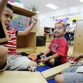 Carlos Ortiz-Torrez, from left, Juan Monterrozas, and Daniel Avile, play with blocks Wednesday in Li...