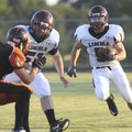 Lincoln’s Shane Oswald looks for running room Thursday during a scrimmage against Gravette.
