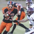 Gravette’s Darrick Strzelecki runs with the ball Thursday while hosting Lincoln in a scrimmage.