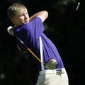 Fayetteville sophomore Sam Hudson, 15, tees off Thursday during the Bulldogs’ match against Rogers H...