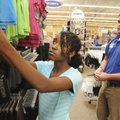  GIVING BACK - Shanice Erby, 11, with the Rogers Unit of the Boys & Girls Club of Benton County, sho...