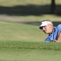 Rogers High senior Jake Rylee hits out of a bunker on No. 8 on Thursday during a match against Sprin...