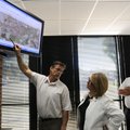 Steve Glass, left, Rogers director of planning and transportation, refers to an aerial map of the pr...
