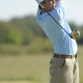 Springdale Har-Ber’s Zach Coats watches his tee shot on No. 8 during the Wildcats’ match against wit...