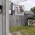 In this Sunday, Aug. 22, 2010 photo, William Glass, next-door neighbor to The Fox Hole strip club, w...
