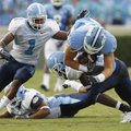 North Carolina tight end Zack Pianalto dives for additional yardage after catching a pass on Sept. 5...