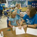Erin Meins, a student teacher from the University of Arkansas, works Friday with Ella Grace on a lit...