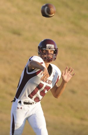 Lincoln quarterback Cheyenne Vaughn throws a pass Thursday during a scrimmage at Gravette.
