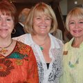 Symphony supporters Bootsie Ackerman, from left, Joan Johnson and Janet Hendren welcome the new SoNA...
