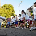 Kindergartners through second-graders line up for a 1K race on South First Street early Saturday mor...