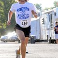 Rogers High School cross country runner Drew Storment approaches the finish line to win this year’s ...