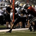 Springdale Har-Ber senior wide receiver Nick Kelley is pushed out of bounds by Tulsa (Okla.) Union j...