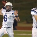 Springdale Har-Ber quarterback Ryan Luther looks for an open receiver during a Class 7A state semifi...