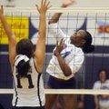 Fayetteville sophomore Phylicia Hill spikes the ball against Greenwood’s Presley Van Kooten (11) for...