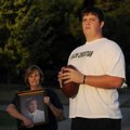 Shiloh Christian offensive lineman Travis Bodenstein stands with his mother, Pam, as she holds a pho...