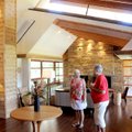 Homeowner Missy Stratton, left, talks with Highlands Church volunteer Kadie Portmann during the 20th...