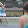 Mel Thompson, left, of Fayetteville, plays tennis Sunday during the third annual Liberty Bank Charit...
