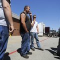 Josh Johnson, from left, Koyle Olsen, and Anthony Hunt, take a smoke break Wednesday outside of thei...