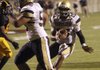 Shiloh Christian's Kiehl Frazier, right, ducks into the endzone on a short run for one of his many touchdowns in the first half of their game against Watson Chapel Monday night at the University of Arkansas Pine Bluff.