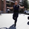A police officer directs people away from the headquarters of the Discovery Channel in Silver Spring...
