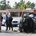Springdale Police respond to a rollover accident Tuesday at the intersection of Quandt Avenue and Th...