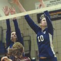Rogers High’s Emily Osborne, left, and Mikalah Booher, right, make a play Tuesday against Siloam Spr...